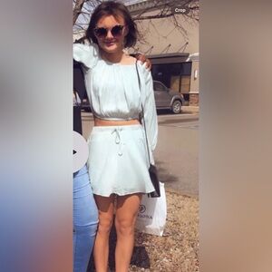 boutique skirt set. Comes with skirt/shorts and blouse. A blueish/green color.